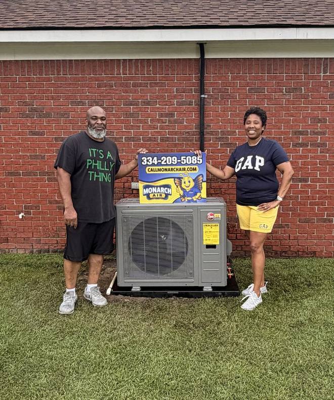 Monarch Air customers beside their newly installed heat pump